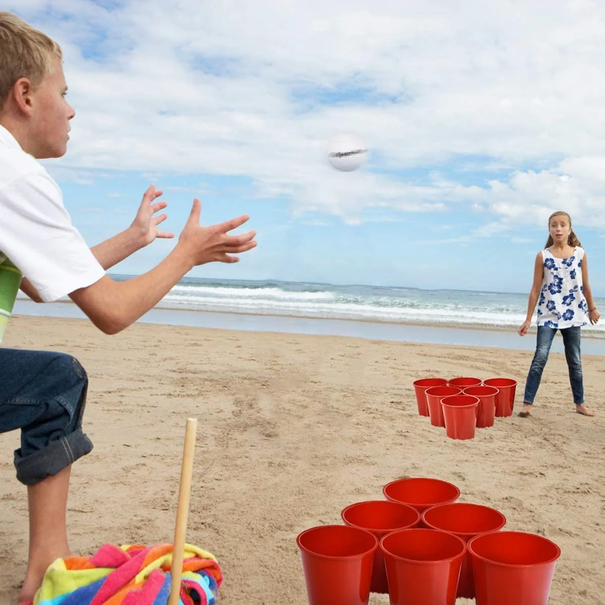 Kids playing Beach Pong on the sand