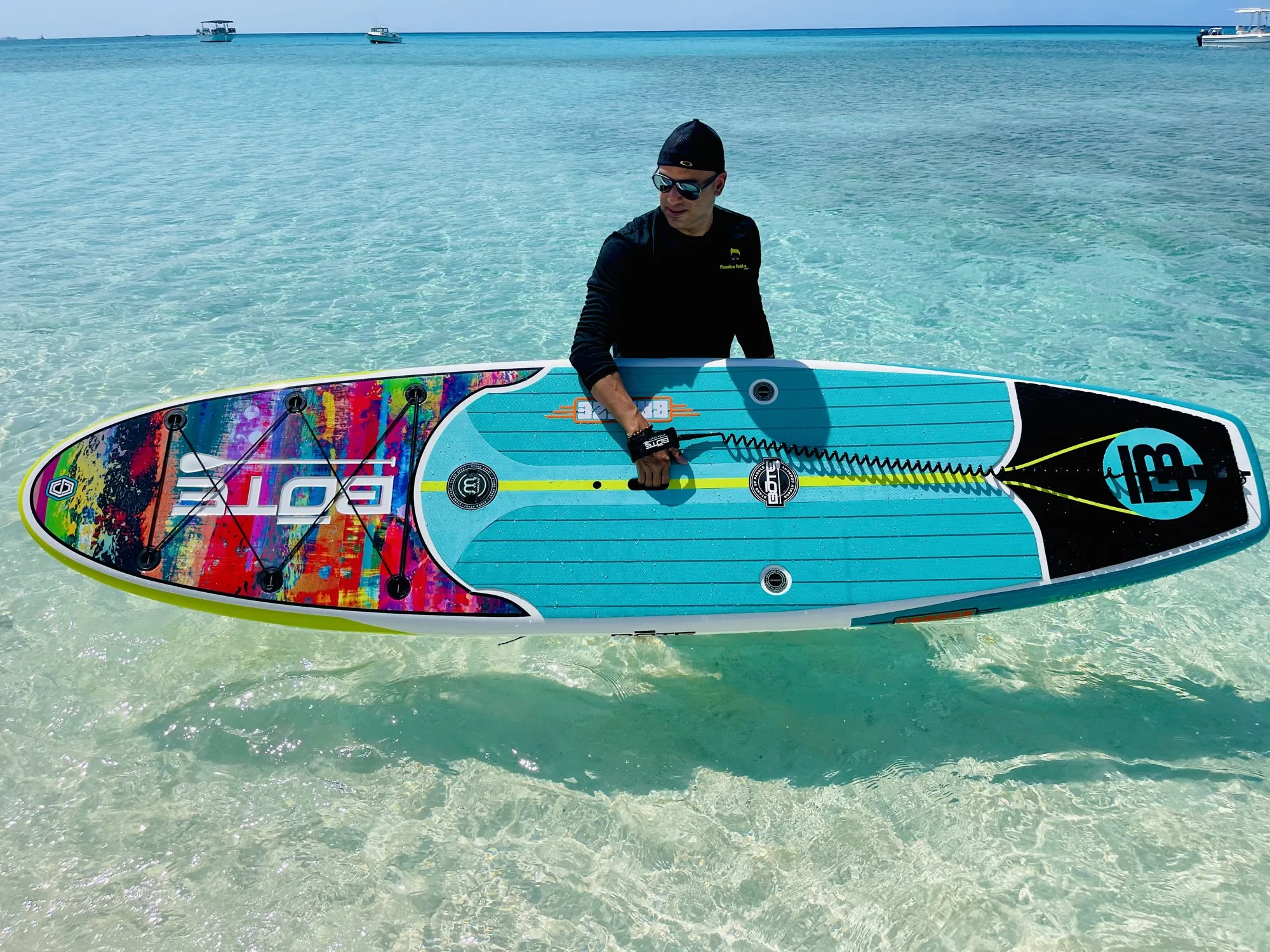 Paddler kneeling on a sea-through paddleboard