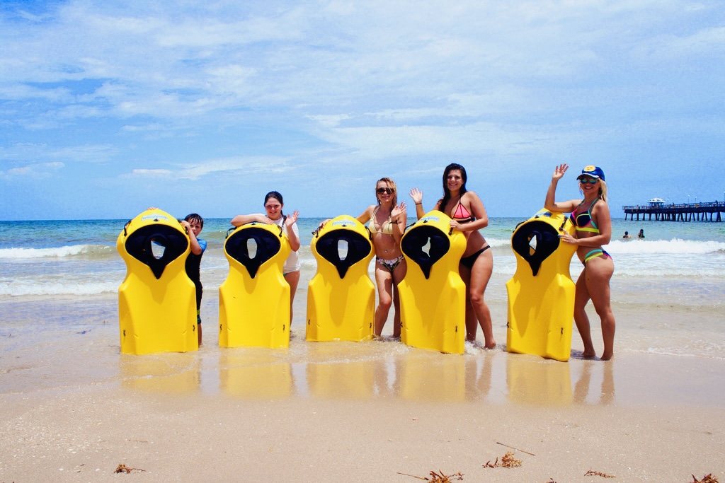Friends on the beach with yellow Seaview Boards